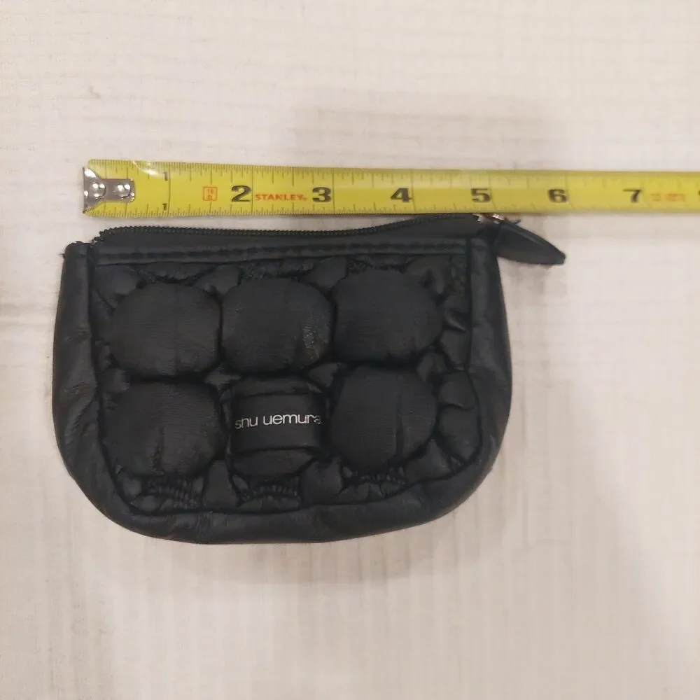 black quilted novelty cosmetic pouch from Shu Uemura